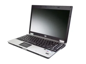 Professional news article featured image: A sleek and modern HP EliteBook 6930p laptop, open on a wooden desk, with its screen displaying a vibrant workspace. The background is softly blurred to emphasize the laptop's design and features.. High quality, editorial style, suitable for news website, 1200x630 pixels, modern design